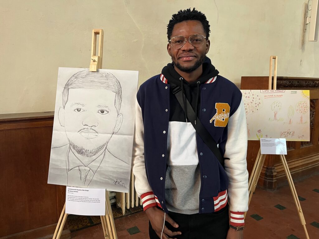Joel and his artwork at St Albans Cathedral.