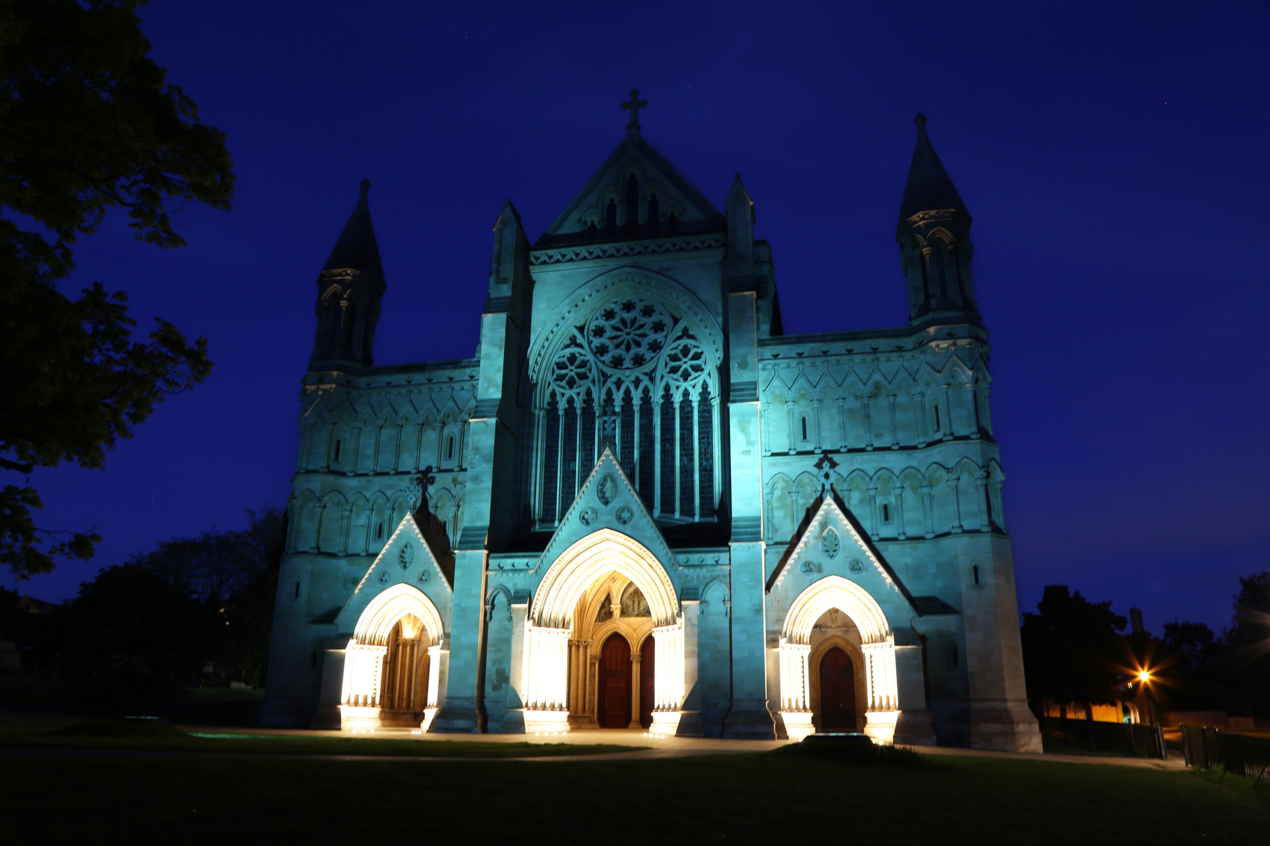 St Albans Cathedral illuminated in the colours of It's OK To Say