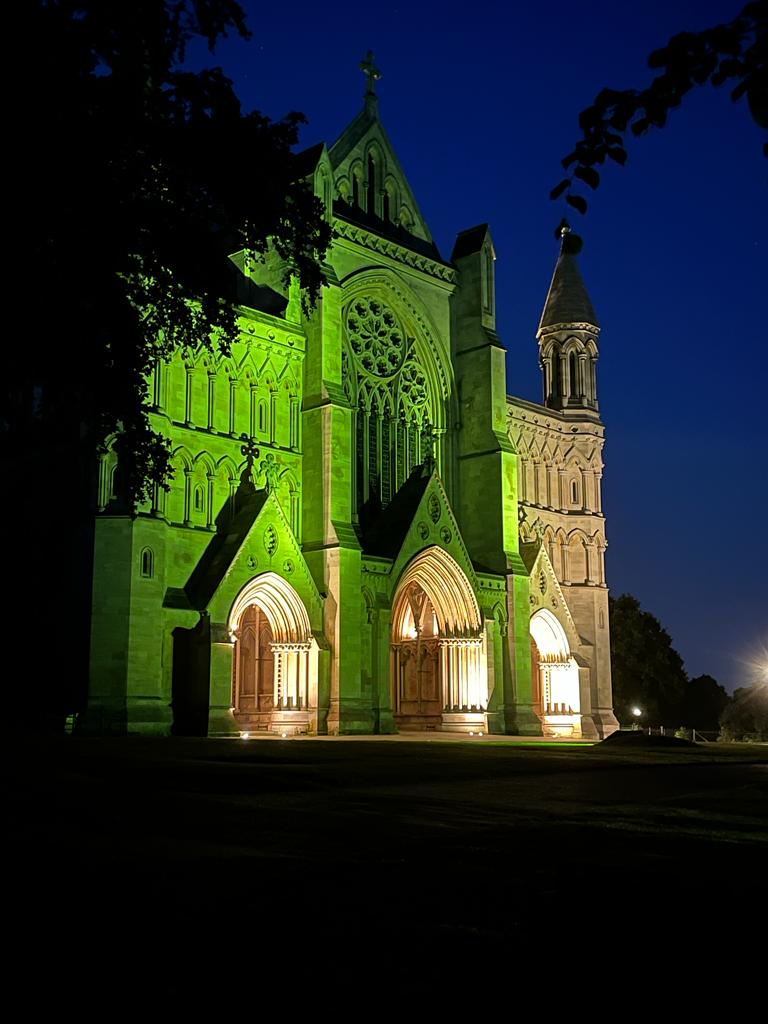 St Albans Cathedral is illuminated in green for SustFest23.