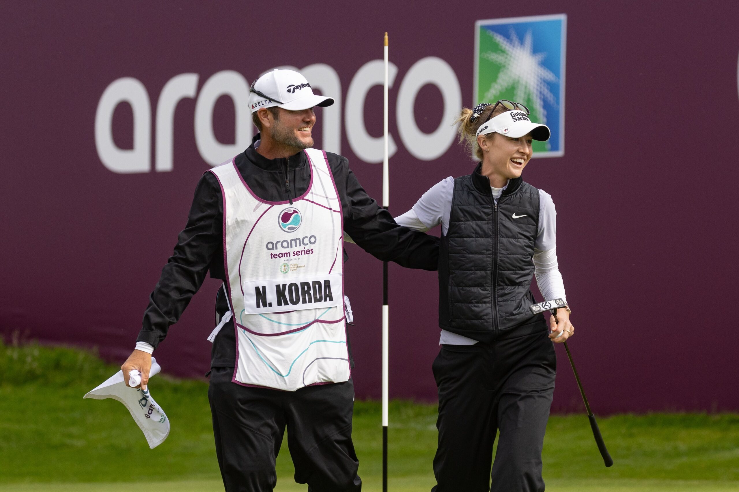 Nelly Korda celebrates with her caddy following her win.