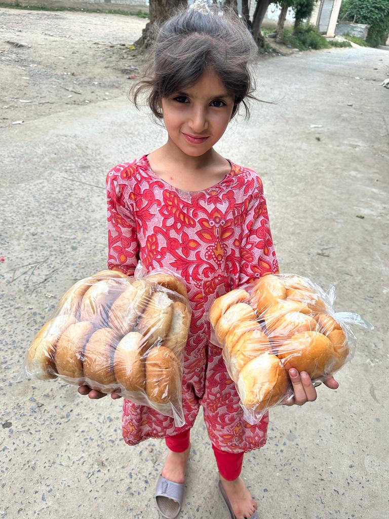 A girl shopping in Baffa using plastic bags