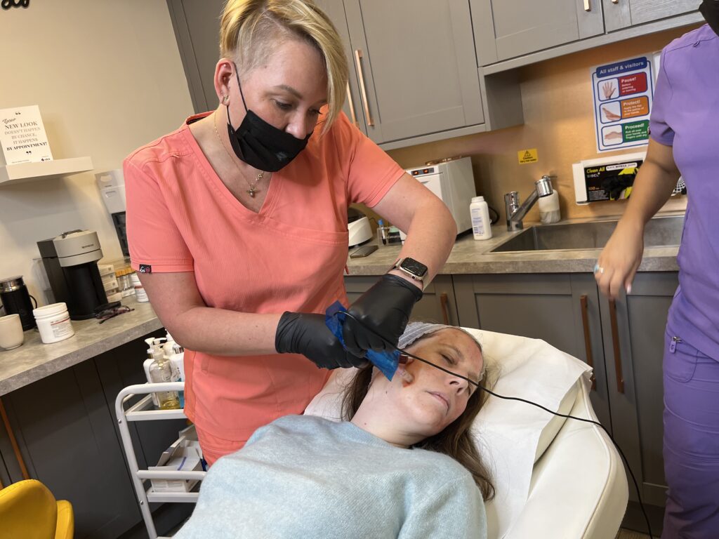 Microneedles are used to help her skin absorb the plasma.