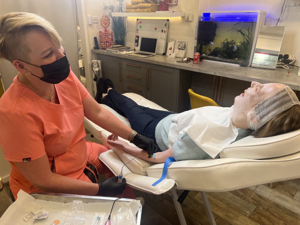 The blood is removed from Laura's "non-writing arm" .