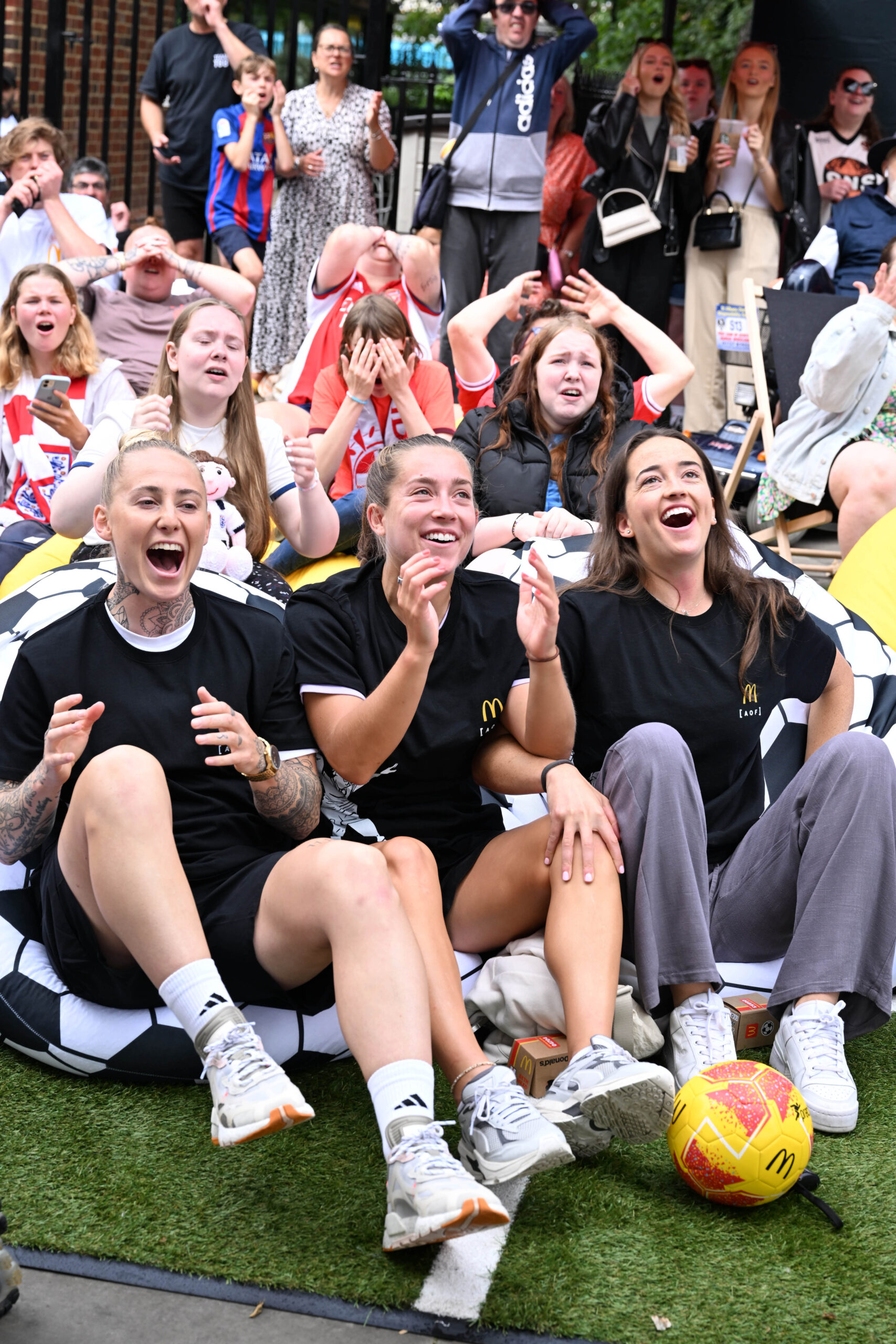 Footballers Leah Galton, Maya Le Tissier and Anna Patten and attend a screening in St. Albans of the England vs. Columbia quarter final match of the FIFA Women's World Cup hosted by McDonald's. Photo: Jeff Spicer/PA Wire.