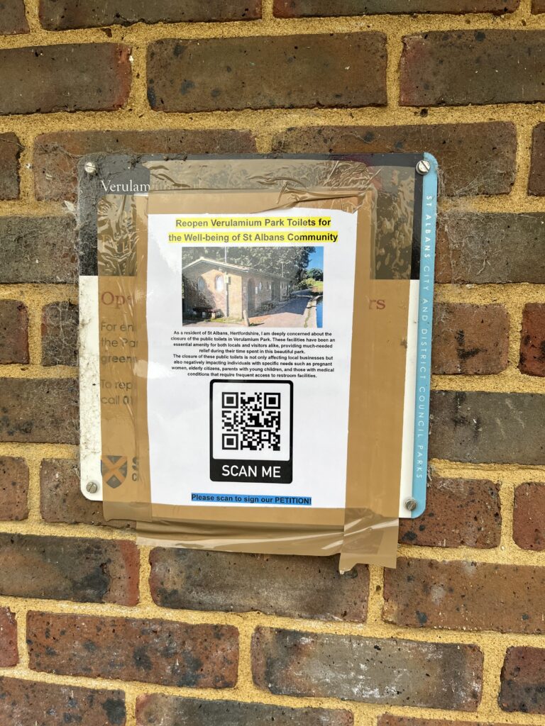 A poster campaigning for the reopening of the public toilets.
