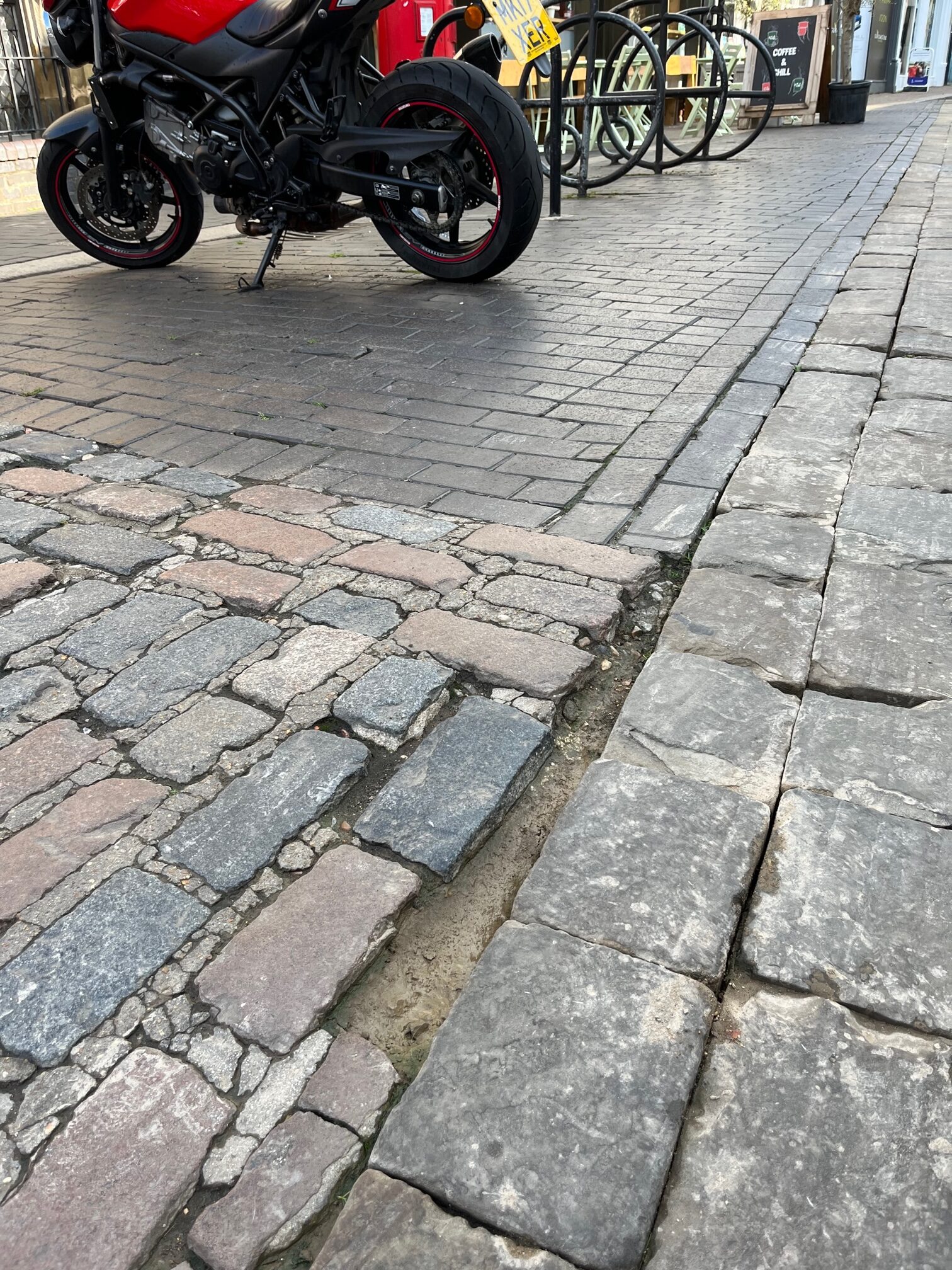 The poor state of the surface in Market Place.