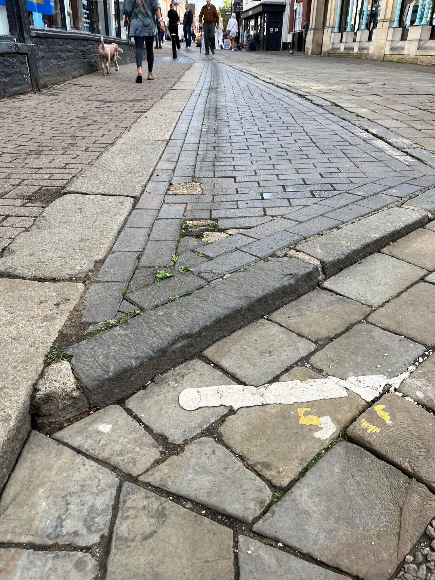 The poor state of the surface in Market Place.