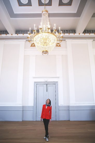 Annie Brewster overlooks the chandelier in the Museum + Gallery.