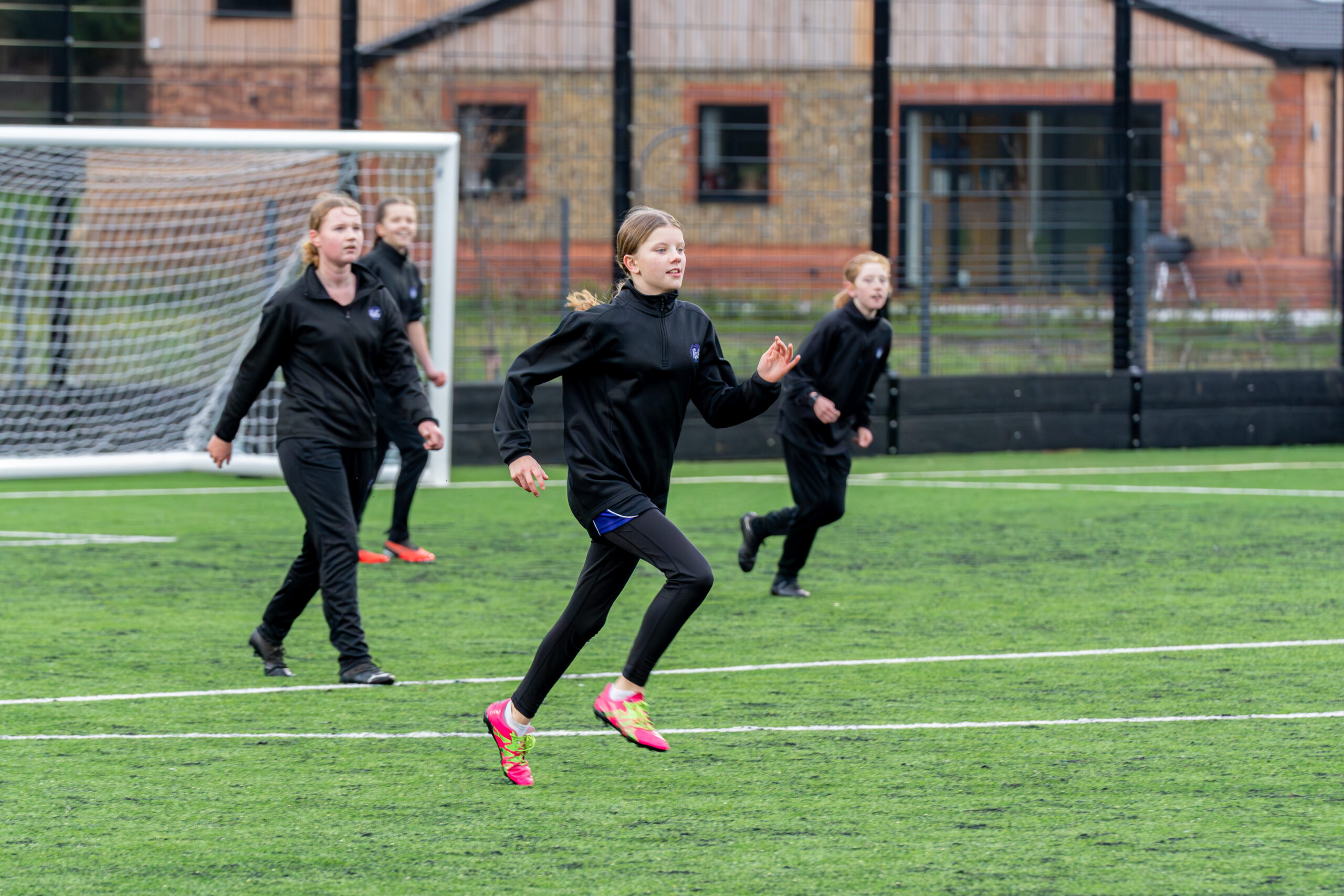 Katherine Warington pupils try out the new pitch. Photo: Elizabeth Keates
