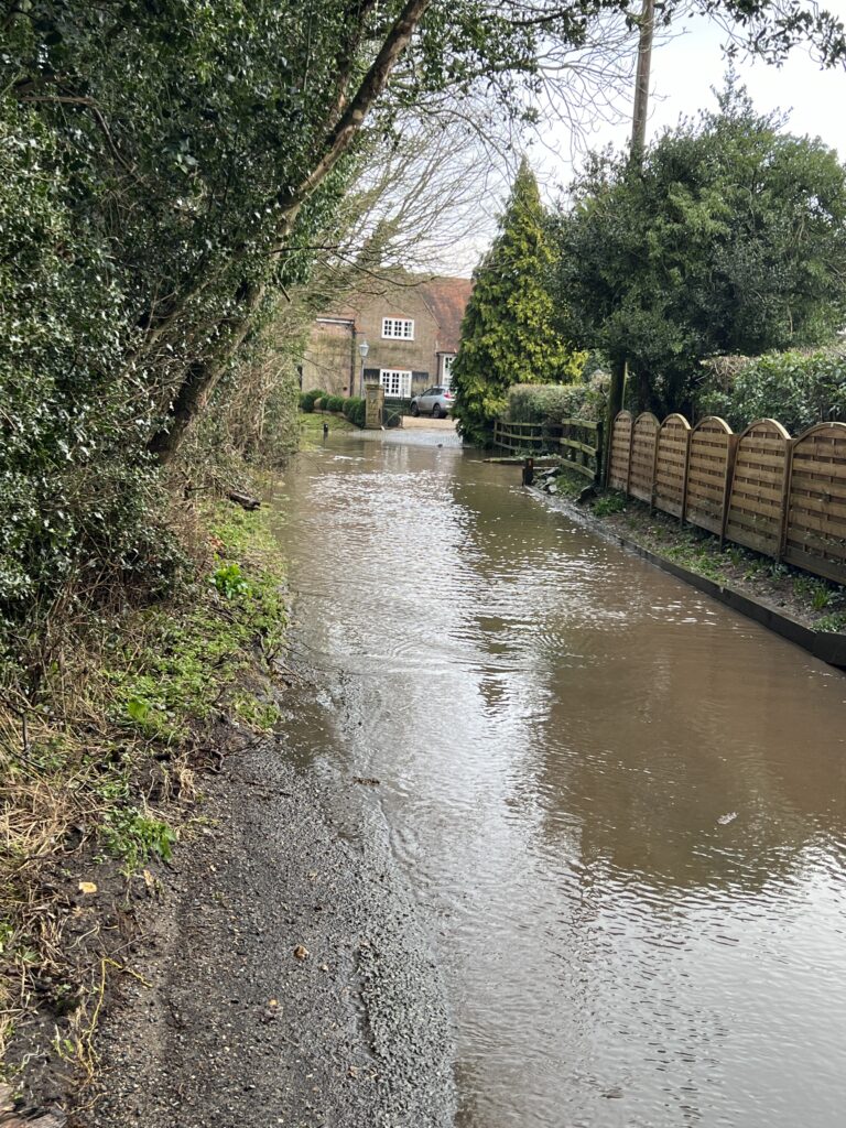 Flooding in Longmead Lane, Ayot St Lawrence. Photo: John Andrews