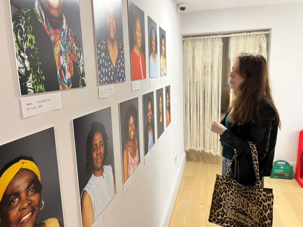 Laura Bill looks around the Becoming Us exhibition.