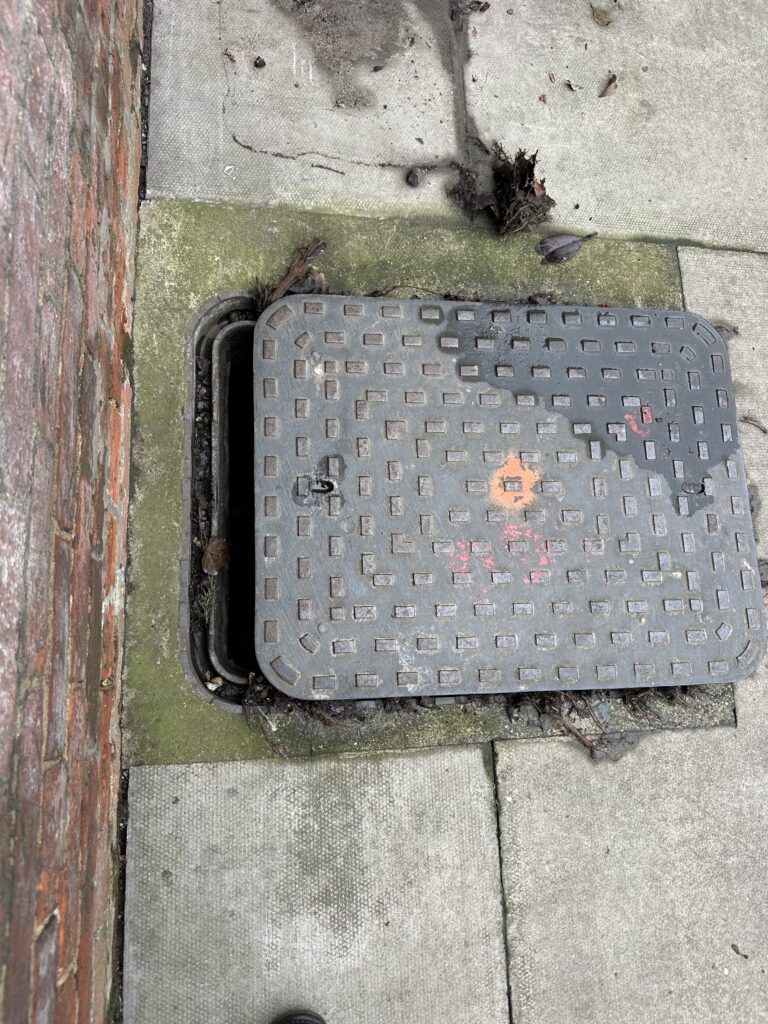 This manhole cover bursts when there is heavy rainfall.