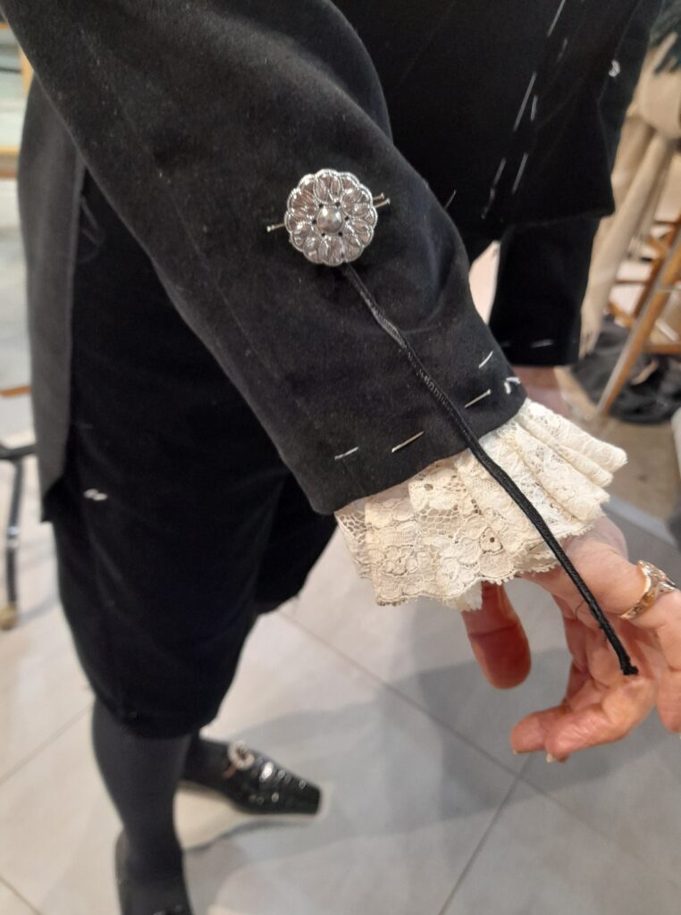 The sleeves of the High Sheriff's jacket.