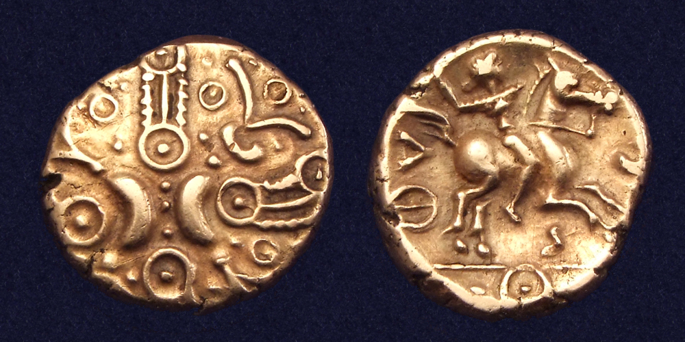 Coin showing Celtic warrior on horse carrying a Caryn - type of bronze trumpet used in warfare. On other side, stylised crescents and wreaths. Credit to Numisantica.com.