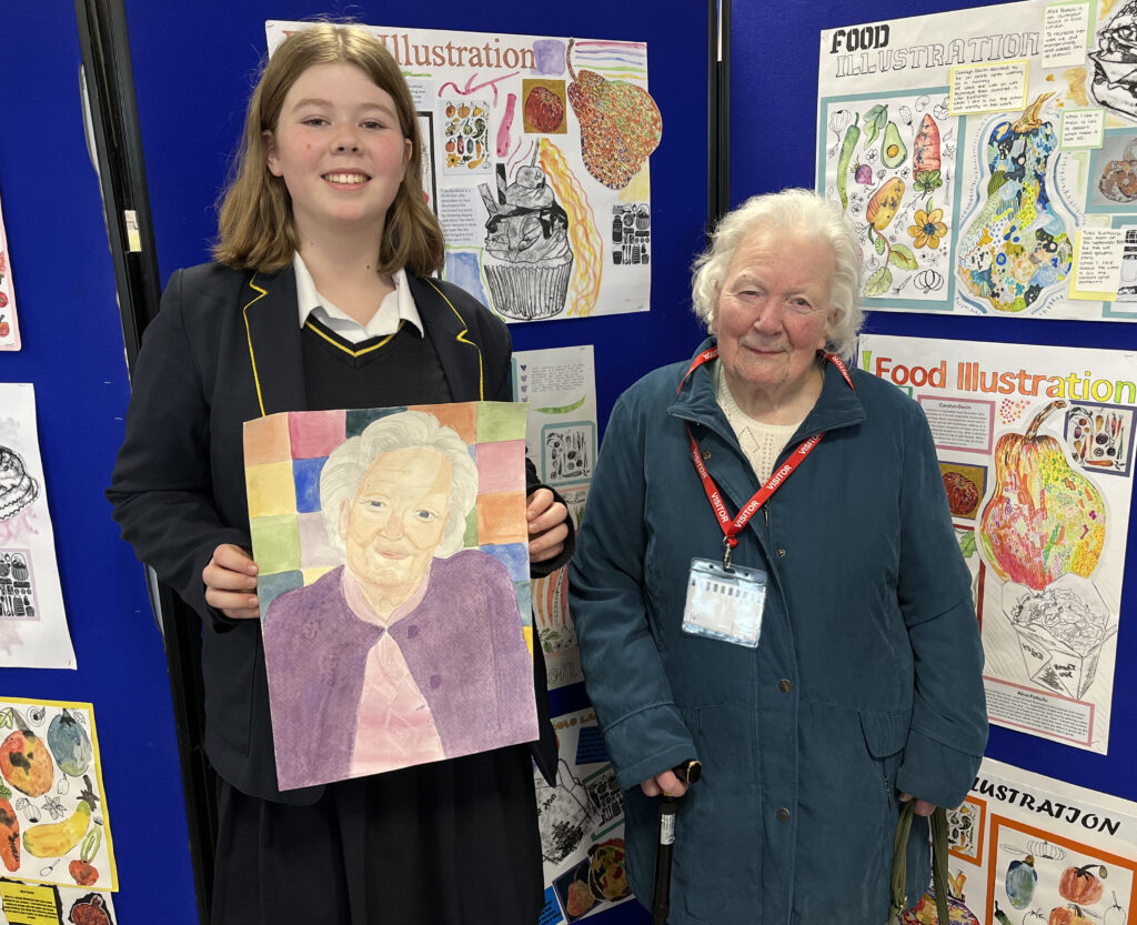 Peggy Liffen with an artwork in progress by student Bethany.
