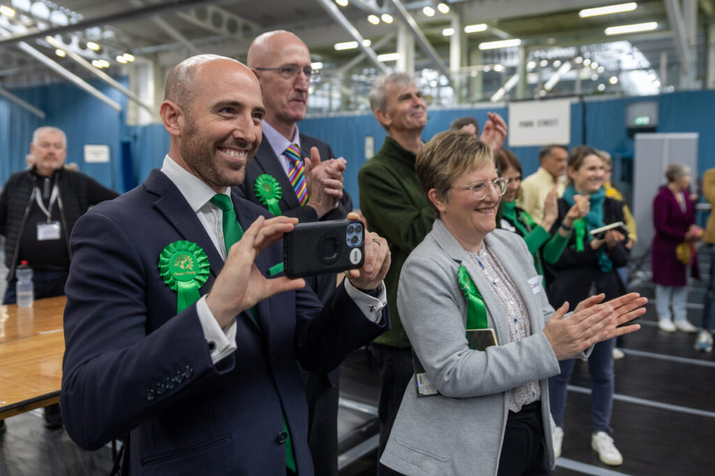 Green Party candidates applauding at Batchwood Sports Centre, St Albans during the May Local Elections.