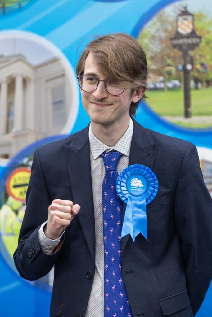 Matt Cowley - Conservative celebrating being elected at Batchwood Sports Centre, St Albans during the May Local Elections.