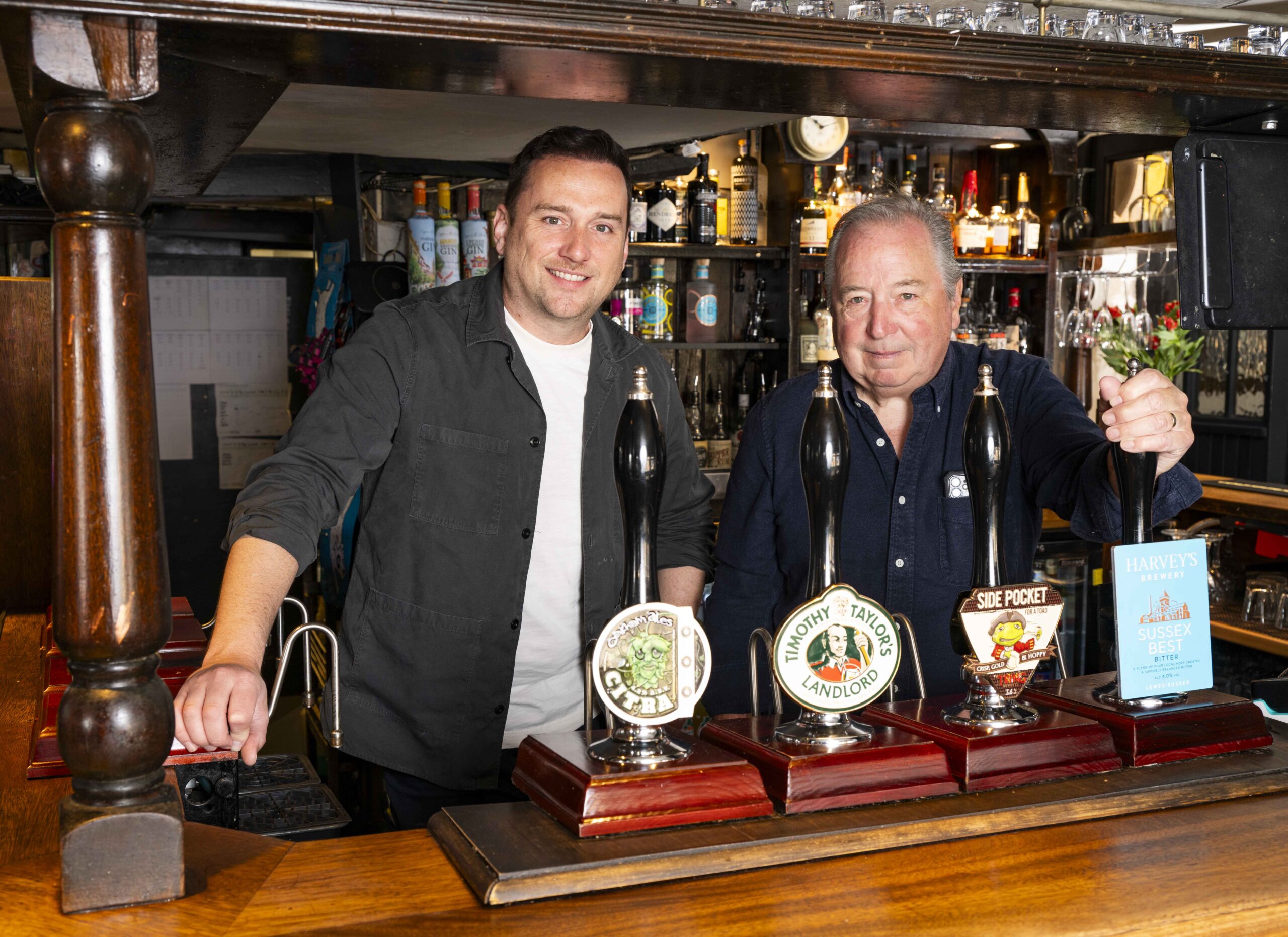 Sean and Will Hughes behind the bar at The Boot.