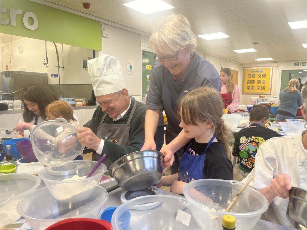 Lib Dem leader Sir Ed Davey joins Baking Buddies in Harpenden.