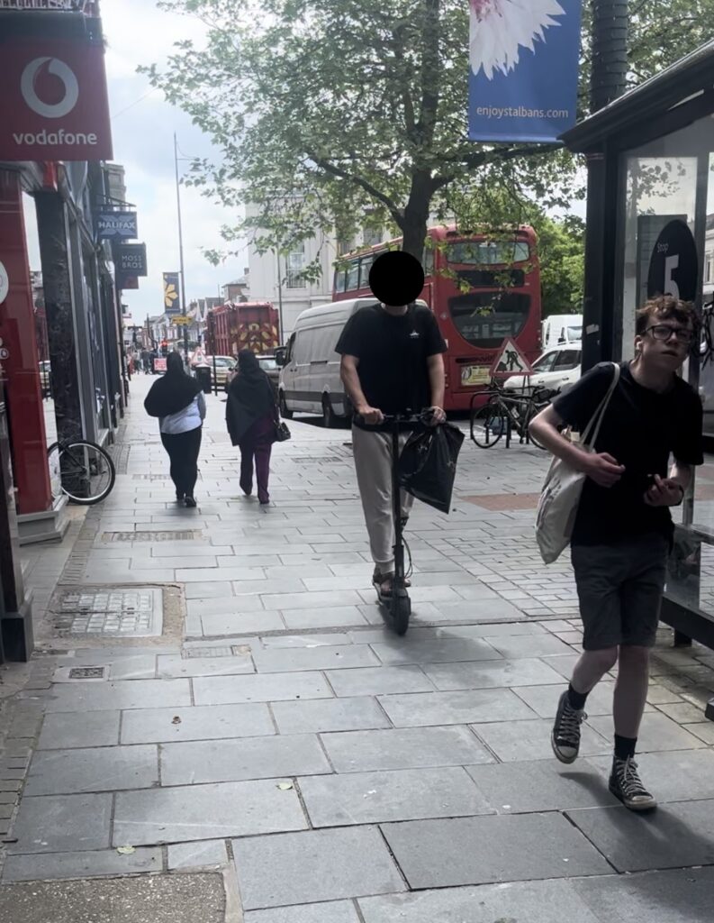 Illegal electric scooter use on the pavement in St Peter's Street.