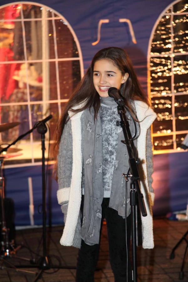 Asha performing at St Albans Christmas Market in 2014 when she was 10.