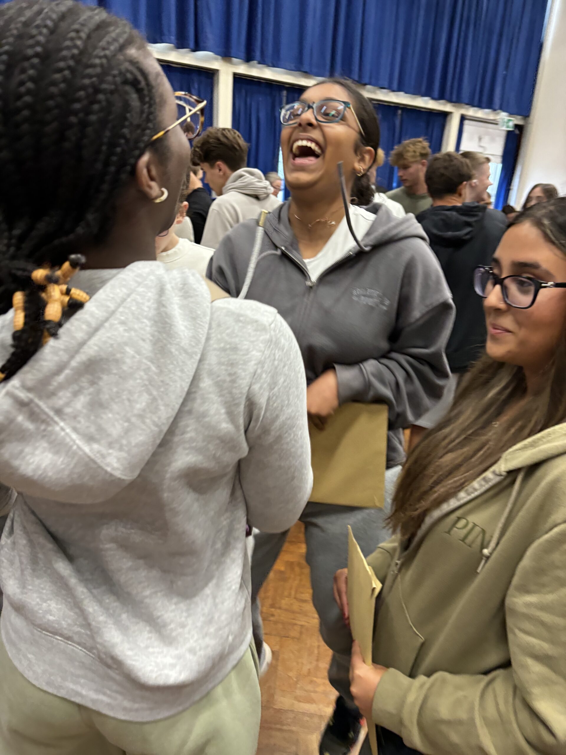 Sandringham School pupils collect their GCSE results.