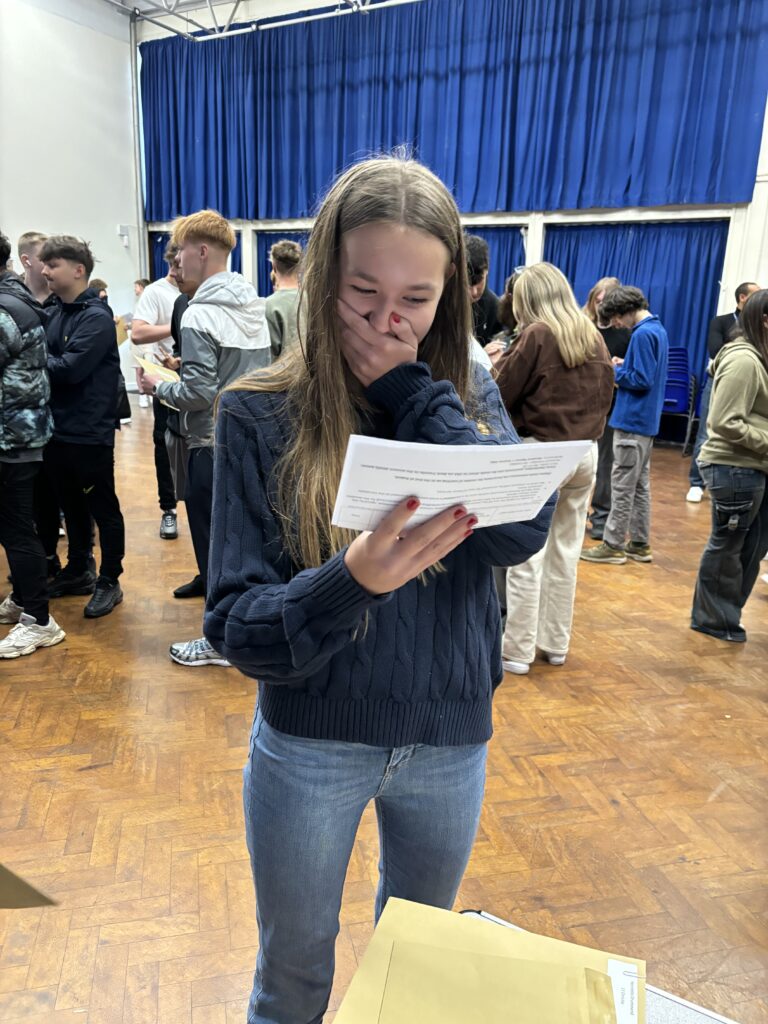 Sandringham School pupils collect their GCSE results.
