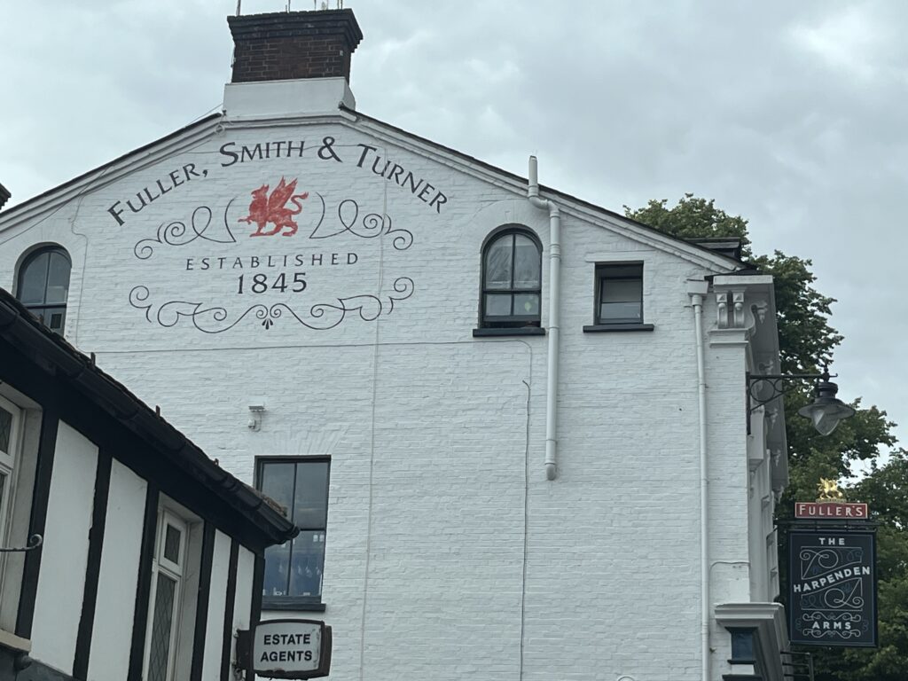 A sign for Fuller, Smith & Turner on the Harpenden Arms.