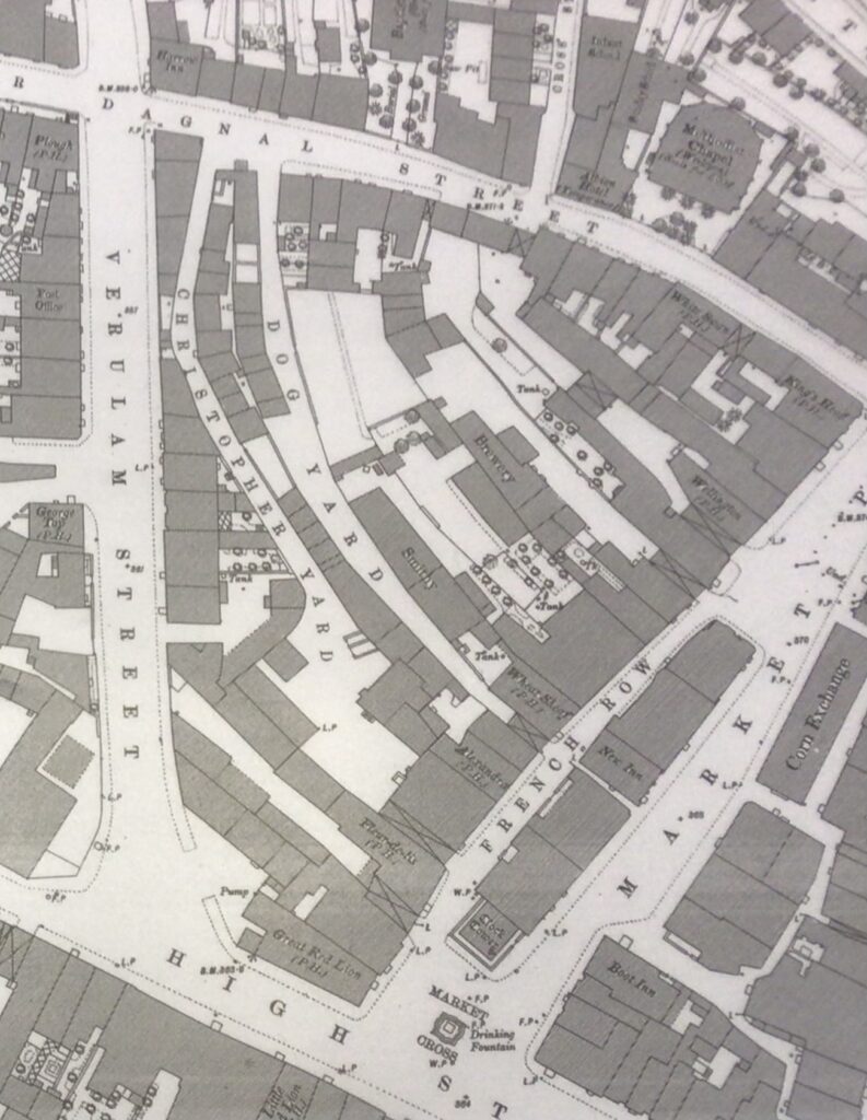 A map from 1880 showing the site later occupied by Christopher Place. The Christopher Inn had by then become a pub called the Alexandra but you can see the extent of the yard. There were several other inns that had yards in that space. The Dog Inn that became the Wheatsheaf Pub was where the shop CEX is now. Photo courtesy of St Albans and Hertfordshire Archaeological and Architectural Society.