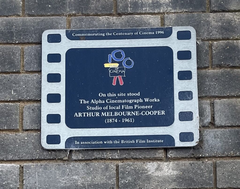 The plaque marking Alpha Cinematographic Works in Alma Road