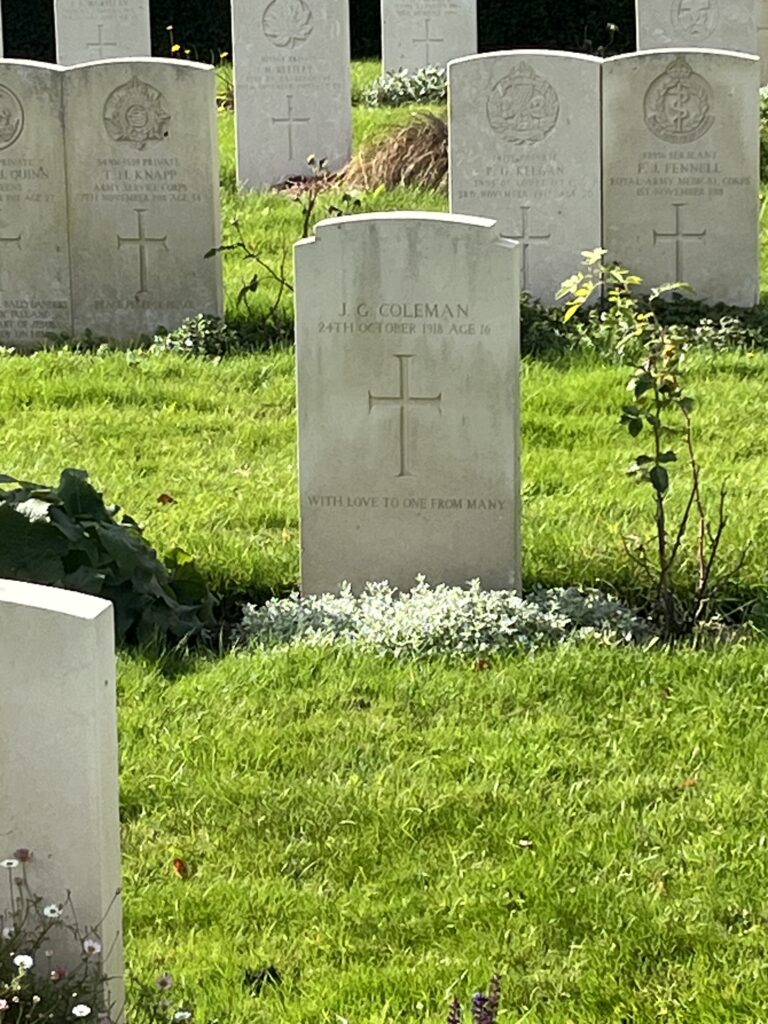 John Coleman is buried in the war graves section.