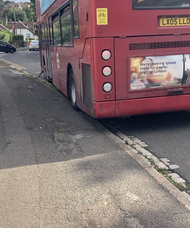 A double decker bus mounts the kerb in New Greens.