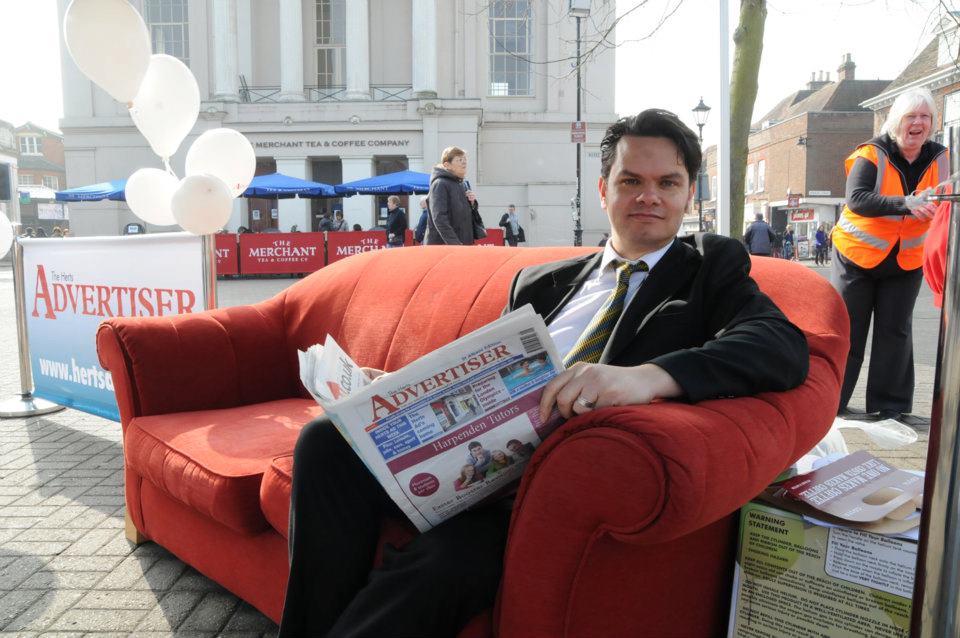 On a red sofa in St Peter's Street as part of a reader engagement programme.