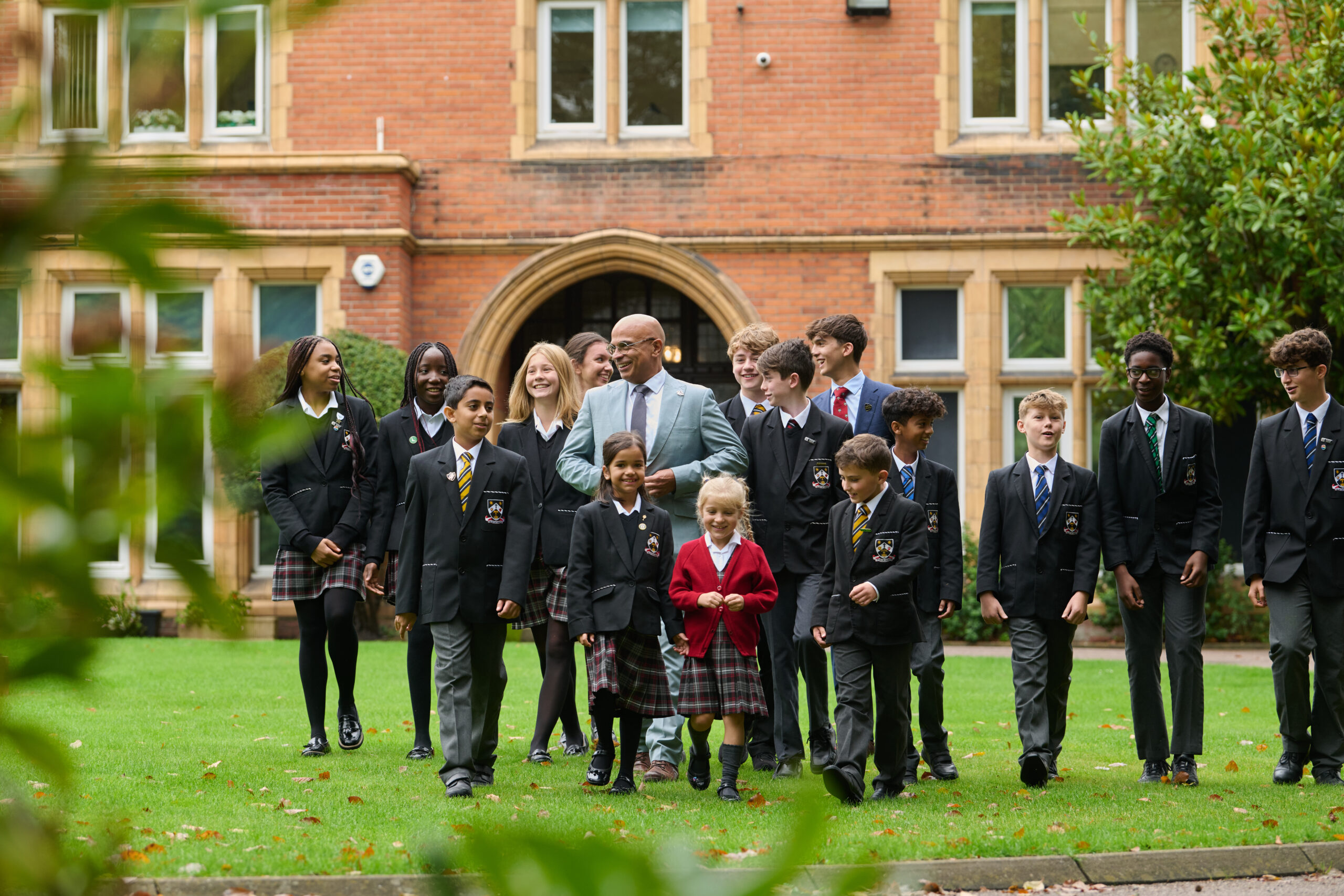 St Columba's College headteacher Karl Guest and pupils.