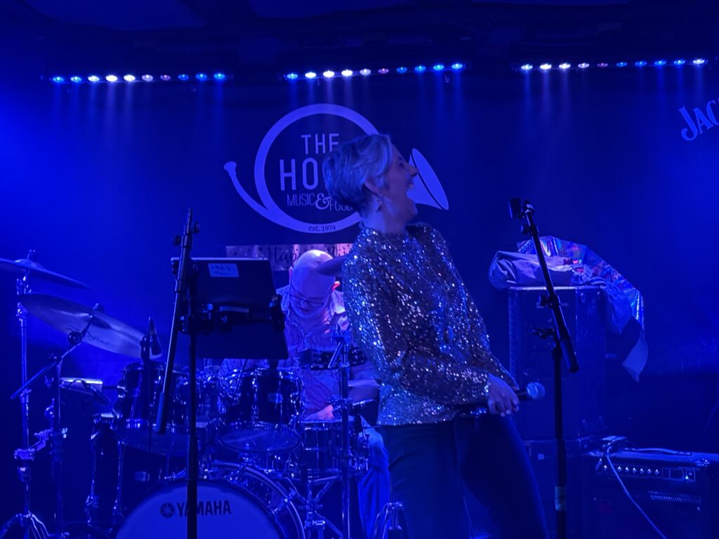 St Albans MP Daisy Cooper performs at The Horn's 50th birthday party.