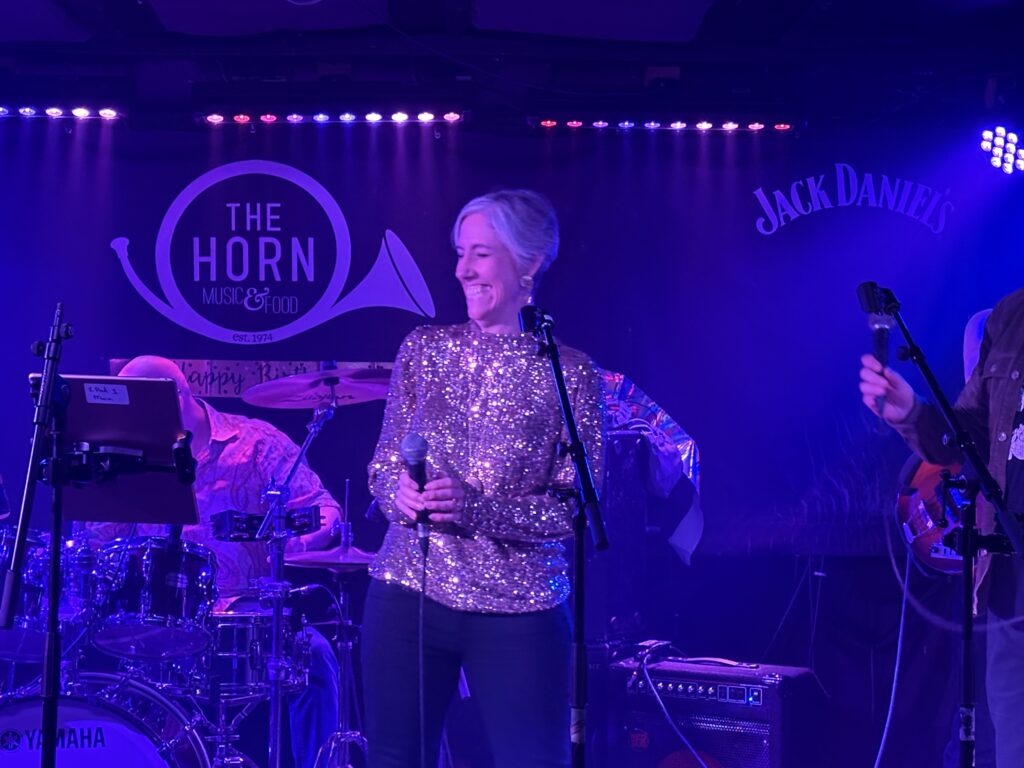 St Albans MP Daisy Cooper performs at The Horn's 50th birthday party.