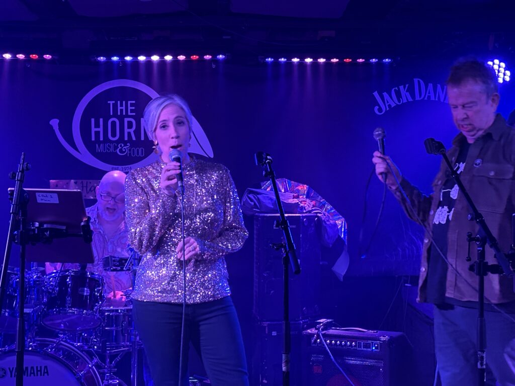 St Albans MP Daisy Cooper performs at The Horn's 50th birthday party.