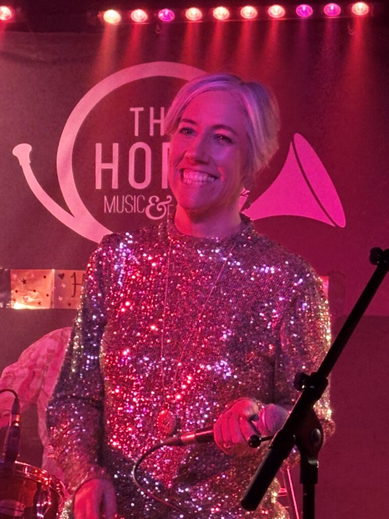 St Albans MP Daisy Cooper performs at The Horn's 50th birthday party.