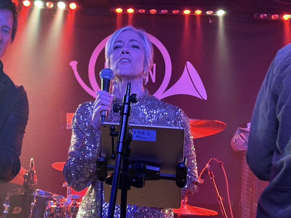 St Albans MP Daisy Cooper performs at The Horn's 50th birthday party.