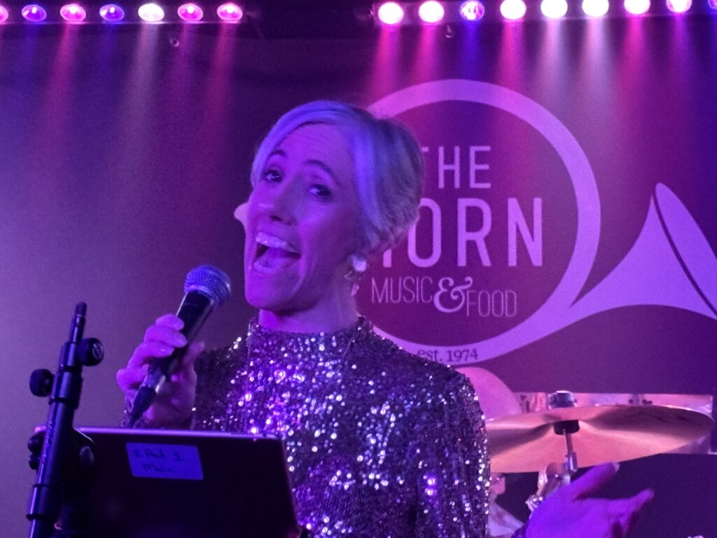 St Albans MP Daisy Cooper performs at The Horn's 50th birthday party.
