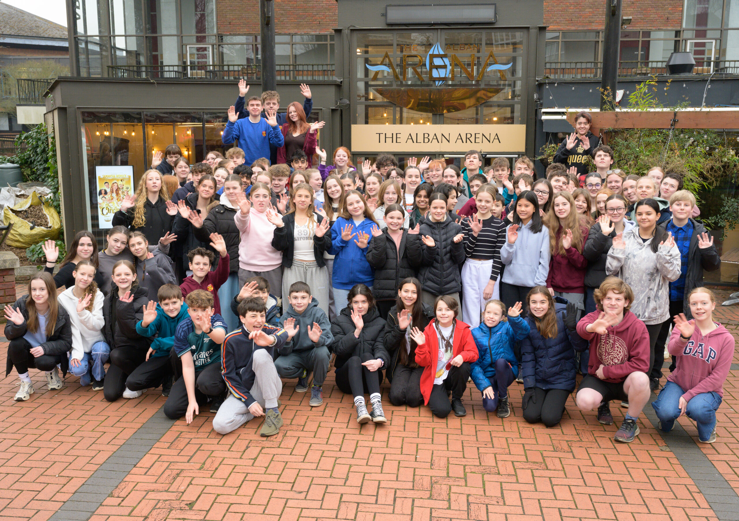 The cast outside the Arena