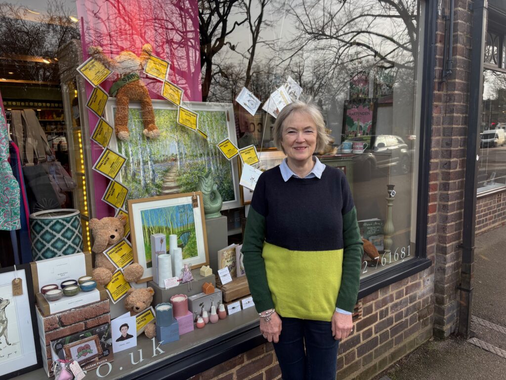 Mary Duke from Serena Hart with a display protesting against the parking charges in her shop window.