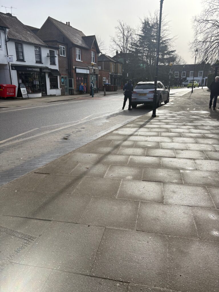 A parking warden targets a solitary vehicle in Leyton Road.