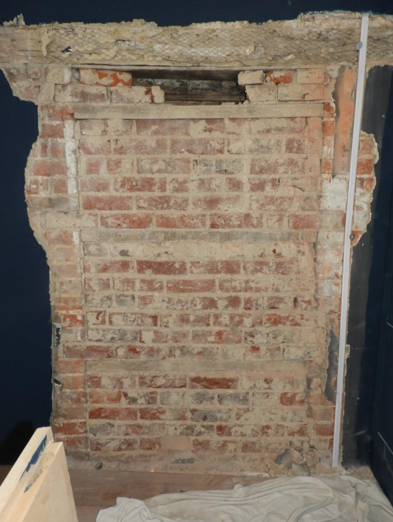 The bricked-up doorway inside Trinder.
