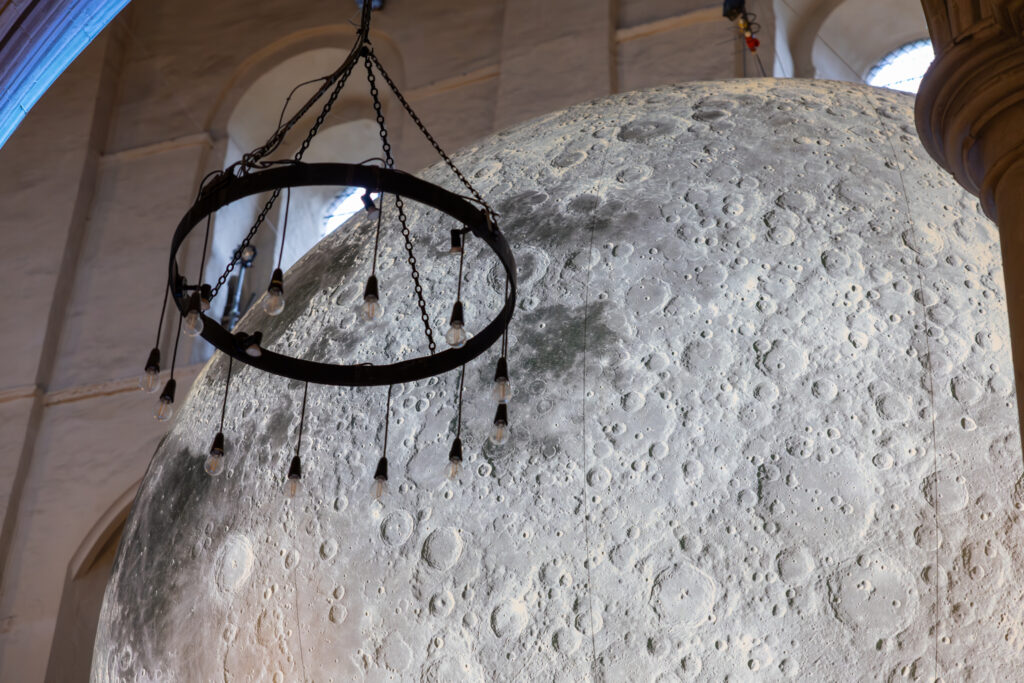 Cathedral choristers singing beneath the Moon. Photo: Toby Shepheard.