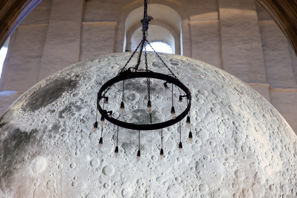 Cathedral choristers singing beneath the Moon. Photo: Toby Shepheard.