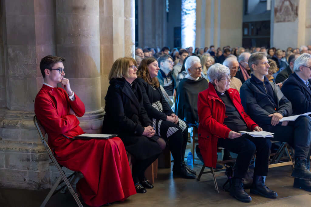 Cathedral choristers singing beneath the Moon. Photo: Toby Shepheard.