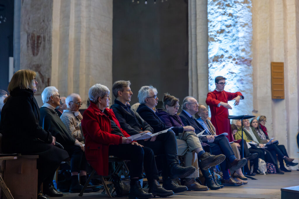 Cathedral choristers singing beneath the Moon. Photo: Toby Shepheard.