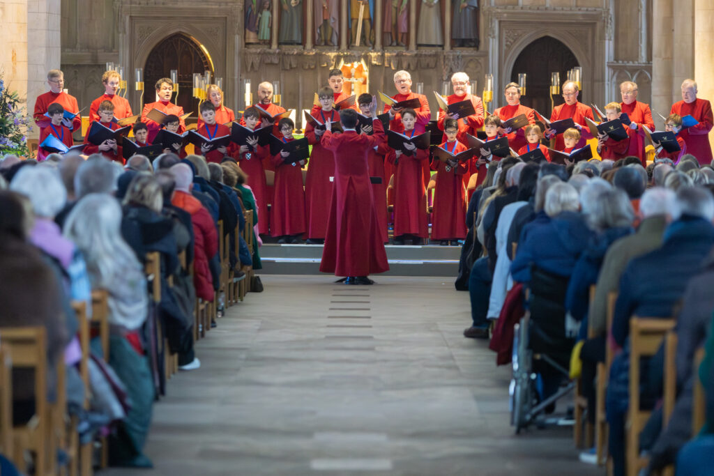 Cathedral choristers singing beneath the Moon. Photo: Toby Shepheard.