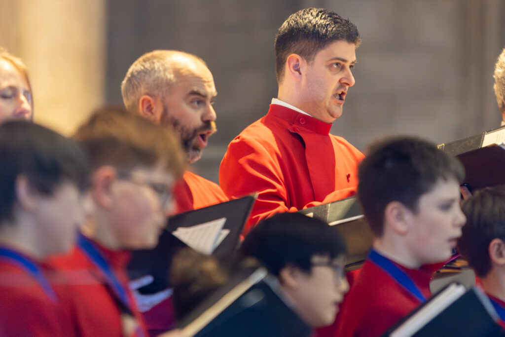 Cathedral choristers singing beneath the Moon. Photo: Toby Shepheard.